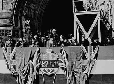 Newfoundland Confederation -- Prime Minister Louis St. Laurent reads welcoming address over a nation-wide network of the C.B.C. April 1949. Seated are (left) F. Gordon Bradley, of Newfoundland, Newly-appointed Secretary of State, and former Prime Minister William Lyon  Mackenzie King. (National Archives of Canada/CP)