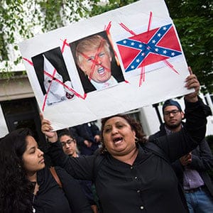 A self proclaimed undocumented immigrant member (R) of 'United We Dream' protests outside the Republican National Committee building in Washington, DC, USA, 12 May 2016. GOP presidential candidate Donald Trump is meeting with Speaker of the House Paul Ryan at the same time.  (Shawn Thew/EPA/CP)