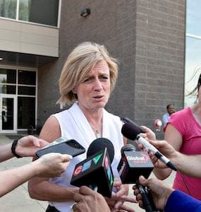 Alberta Premier Rachel Notley speaks with media about the wildfires in Fort McMurray, Alta., on Wednesday May 4, 2016. The wildfire has already torched 1,600 structures in the evacuated oil hub of Fort McMurray and is poised to renew its attack in another day of scorching heat and strong winds.THE CANADIAN PRESS/Jason Franson