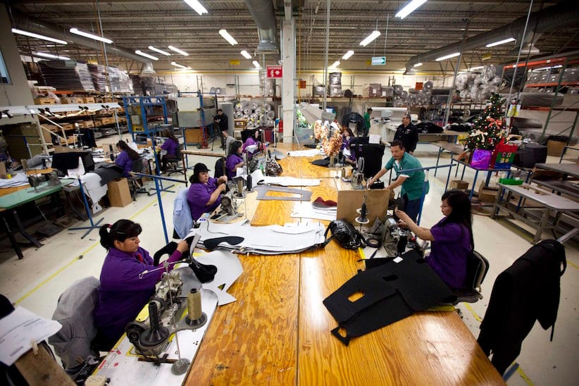 In this Dec. 27, 2013 photo, workers manufacture car dash mats at a maquiladora belonging to the TECMA group in Ciudad Juarez, Mexico. (AP Photo/Ivan Pierre Aguirre)