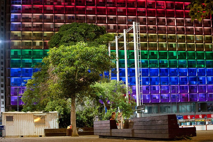 Tel-Aviv city hall lit up with rainbow flag colors in solidarity with Florida's shooting attack victims, in Tel Aviv, Israel, Sunday, June 12, 2016.  The shooting attack in Orlando, Florida, USA, Sunday, left more than 50 people dead amid a multitude of events celebrating LGBT Pride Month. (Oded Balilty/AP)