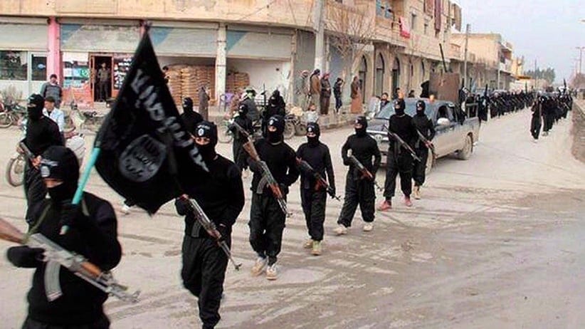 This undated file image posted on a militant website on Jan. 14, 2014, which has been verified and is consistent with other AP reporting, shows fighters from the al-Qaida linked Islamic State of Iraq and the Levant (ISIL) marching in Raqqa, Syria. (AP)