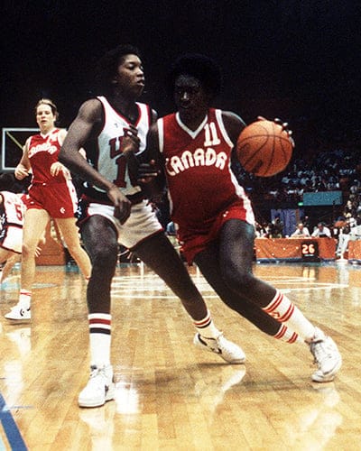 Canada's Sylvia Sweeney (right) runs past a guard during women's basketball action at the 1984 Olympic Games in Los Angeles. (JM/COC/CP)
