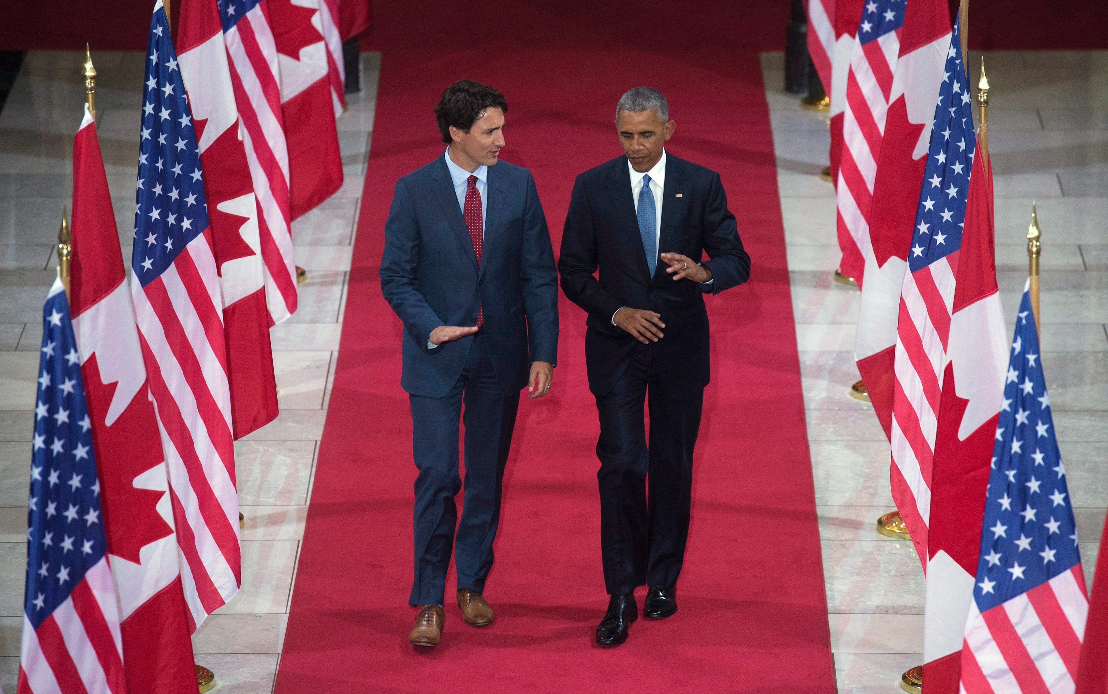 Prime Minister Justin Trudeau speaks with United States President Barack Obama as they walk through the Hall of Honour on Parliament Hill in Ottawa, Wednesday June 29, 2016. THE CANADIAN PRESS/Adrian Wyld