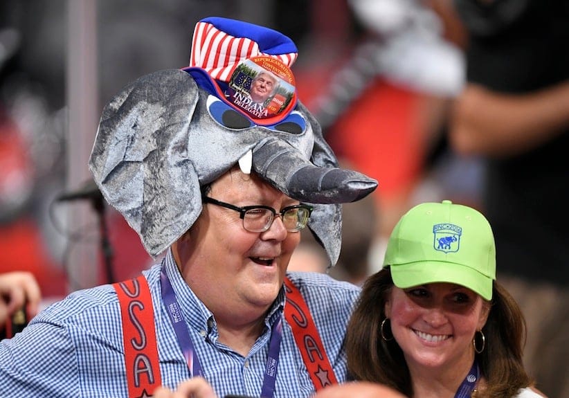 A Donald Trump supporter wears an elephant-shaped hat during the opening day of the Republican National Convention in Cleveland, Monday, July 18, 2016. (AP Photo/Mark J. Terrill)