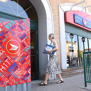 A customer arrives at a Canada Post post office as an ongoing labour dispute between the Canadian Union of Postal Workers and Canada Post continues, on Tuesday, July 5, 2016 in Ottawa. (Justin Tang/CP)