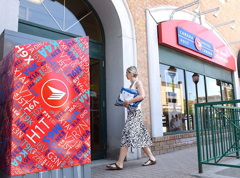 A customer arrives at a Canada Post post office as an ongoing labour dispute between the Canadian Union of Postal Workers and Canada Post continues, on Tuesday, July 5, 2016 in Ottawa. (Justin Tang/CP)