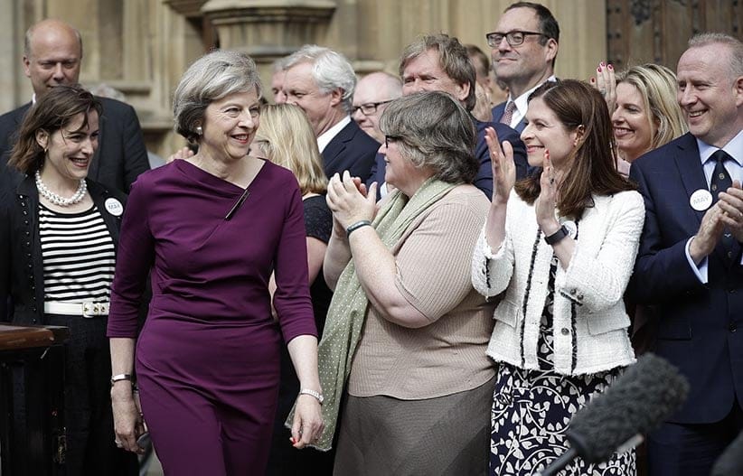 Conservative Party leadership candidate and current home secretary Theresa May is joined by supporting MPs as she speaks outside Parliament (Peter MacDiarmid/REX/Shutterstock/CP)