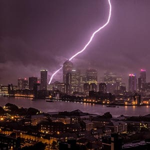 Massive Lightning strike over Canary Wharf business park buildings and River Thames (Guy Corbishley/Alamy)