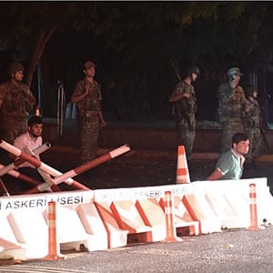 Turkish security officers detain unknown individuals on the side of the road on July 15, 2016 in Istanbul, during a security shutdown of the Bosphorus Bridge. Turkish Prime Minister Binali Yildirim on July 15 denounced what he said was an "illegal attempt" by elements in the military after bridges were partially shut down in Istanbul and jets flew low over Ankara. "We are working on the possibility of an attempt. We will not allow this attempt," he told NTV television by telephone, without expanding on the nature of the move but saying it was by a group in the Turkish military.  (BULENT KILIC/AFP/Getty Images)