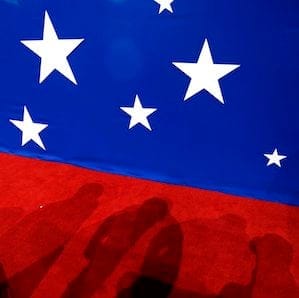 The shadow of delegates are seen on the convention floor during the second day of the Republican National Convention in Cleveland, Tuesday, July 19, 2016. (AP Photo/John Locher)