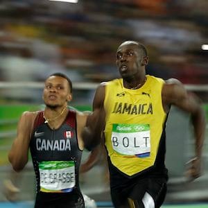 Canada's Andre De Grasse, left, and Jamaica's Usain Bolt compete in a men's 200-meter semifinal, during the athletics competitions of the 2016 Summer Olympics at the Olympic stadium in Rio de Janeiro, Brazil, Wednesday, Aug. 17, 2016. (AP Photo/Matt Slocum)
