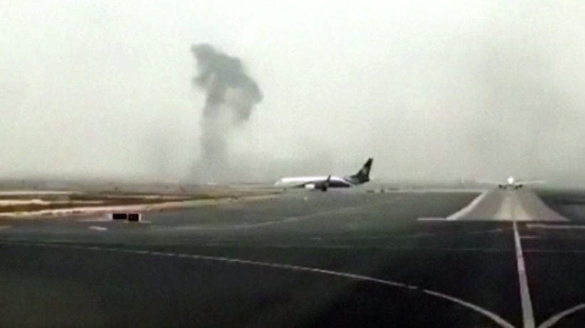 This image made from video shows this image made from video shows smoke rising after an Emirates flight crash landed at Dubai International Airport on Wednesday, Aug. 3, 2016.  (Hayen Ayari via AP) rising after an Emirates flight crash landed at Dubai International Airport on Wednesday, Aug. 3, 2016. The plane at right was unaffected Dubai-based airline Emirates has confirmed that there were no fatalities on a flight from India that crash-landed . (Hayen Ayari via AP)