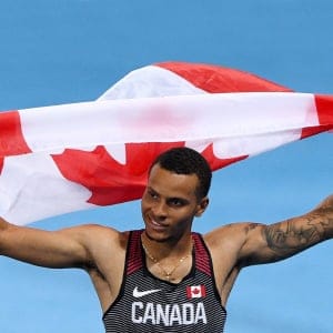 Canada's Andre De Grasse celebrates silver in the men's 200m final. (Sean Kilpatrick/CP)