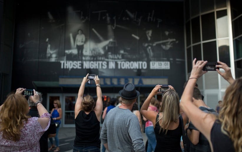 Fans take photos outside the Air Canada Centre ahead of the Tragically Hip Man Machine Poem tour stop in Toronto. (Photograph by Nick Iwanyshyn)