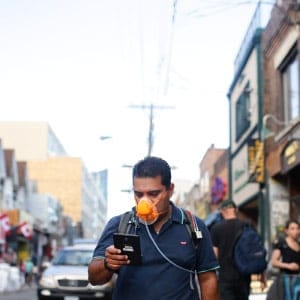 Sidarta Medina measures odour in Kensington Market Toronto. (Photograph by Cole Burston)