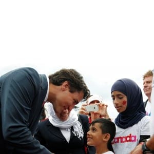Canada's Prime Minister Justin Trudeau shakes hands with a Syrian refugee during Canada Day celebrations on Parliament Hill in Ottawa, Ontario, Canada, July 1, 2016. (Chris Wattie/REUTERS)