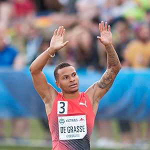 Andre De Grasse reacts to spectators after winning the senior men's 100 metre final at the Canadian Track and Field Championships and Selection Trials for the 2016 Summer Olympic and Paralympic Games, in Edmonton, Alta., on Saturday, July 9, 2016. (DAN RIEDLHUBER/CP)