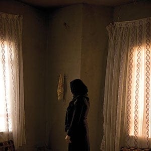 Zanib who escaped three times from ISIS at Yazidi  refugee camp Khanke outside of Duhok, Iraq, July 26, 2016. Zane did not give her last name or want her face visible because female relatives are still captive. (Photograph by Peter Bregg C.M.)