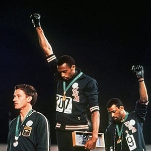 In this Oct. 16,1968 file photo, extending gloved hands skyward, U.S. athletes Tommie Smith, center, and John Carlos, right, stare downward during the playing of the "Star-Spangled Banner" after Smith received the gold and Carlos the bronze for the 200 meter run at the Summer Olympic Games in Mexico City. The man who famously raised a black glove for racial equality might have been offended. Instead, Tommie Smith was pleased. Pleased because he thinks Brandon Marshall's heart was in the right place. Pleased because 40 years after Mexico City there's a different kind of statement another generation can now make. (AP/CP)
