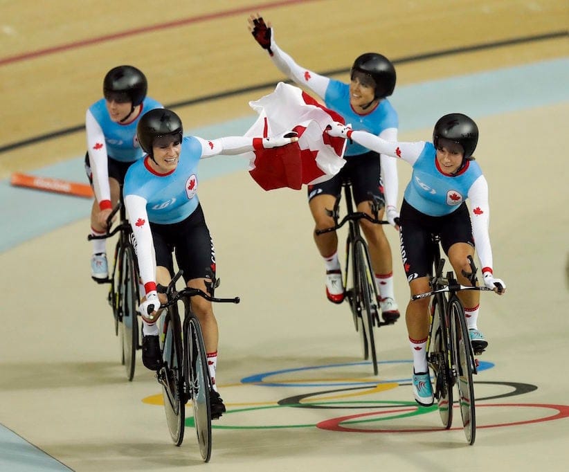 Canada's team celebrates after winning bronze in the women's team pursuit finals cycling event at the Rio Olympic Velodrome during the 2016 Summer Olympics in Rio de Janeiro, Brazil, Saturday, Aug. 13, 2016. (AP Photo/Pavel Golovkin)
