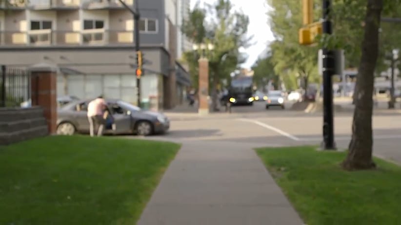 Edmonton actor Jesse Lipscombe confronts a man in a car who called out racial slurs while Lipscombe was filming a video. 
(CP Video)