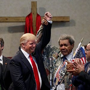 Promoter Don King (center R) raises the hand of Republican presidential nominee Donald Trump (center L) in triumph at a gathering of clergy at the New Spirit Revival Center in Cleveland Heights, Ohio, U.S. September 21, 2016. ( Jonathan Ernst/Reuters)