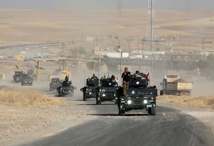 Iraqi special forces advance towards the city of Mosul, Iraq, Wednesday, Oct. 19, 2016. A senior Iraqi general on Wednesday called on Iraqis fighting for the Islamic State group in Mosul to surrender as a wide-scale operation to retake the militant-held city entered its third day. (AP Photo/Khalid Mohammed)