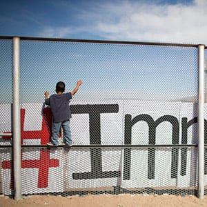 Two small boys balance themselves on the rail of a border fence during an event organized by the Border Network for Human Rights, on the outskirts of  Ciudad Juarez, Mexico, Monday, Feb. 15, 2016. (Ivan Pierre Aguirre/AP)