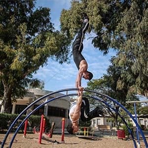 Members of  Palestinians sports group “Bar Palestine” Preparing to perform Street workout, on the public garden in Gaza City, on Dec 11, 2015. Street workout, that is still new to Gaza, is a growing sport across the world. (Hosam Salem)
