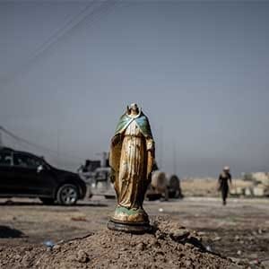 A destroyed figurine of the Christian Virgin Mary in the town of Bartella, Iraq on October 23, 2016. (Photograph by Cengiz Yar)