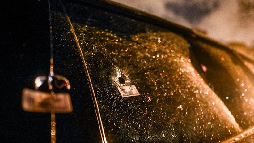 A bullet hole in a Pontiac Grand Prix belonging to Precious Land, a mother of three who has been in a coma ever since a shooting over the Memorial Day weekend in Chicago, May 28, 2016. (Julie Turkewitz/The New York Times/REDUX)