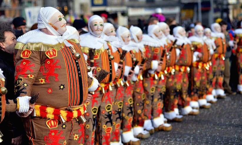 ''Gilles'' in traditional costumes stand during the carnival in Binche, one of the most ancient and representative tradition of Wallonia (Eric Lalmand/AGP/Getty Images)