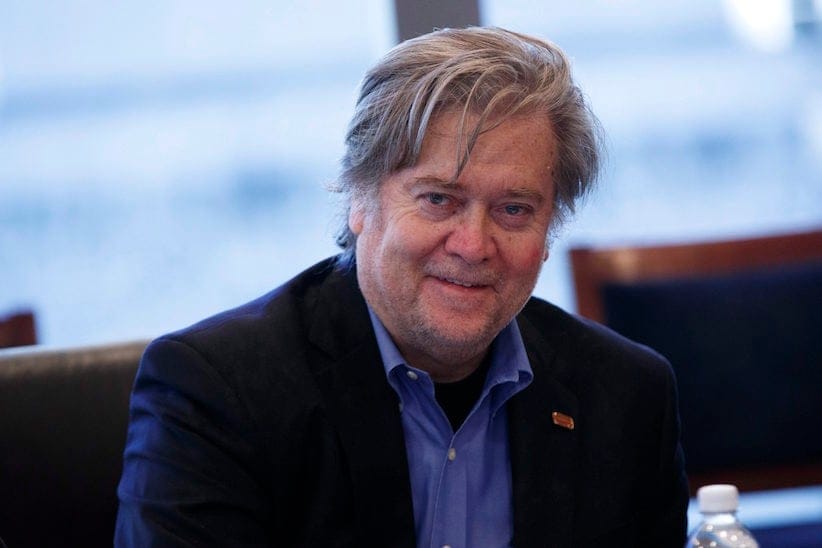 Steve Bannon, campaign CEO for Republican presidential candidate Donald Trump, right, looks on during a national security meeting with advisors at Trump Tower, Friday, Oct. 7, 2016, in New York. (AP Photo/ Evan Vucci)