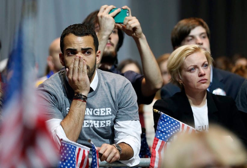 Hillary Clinton supporters react as results come in at an election night party for the Democratic presidential candidate at the Jacob K. Javits Convention Center in New York, late on Tuesday, Nov. 8, 2016.   (Vernon Bryant/The Dallas Morning News via AP)