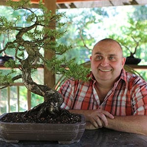 Vancouver Island University's Culinary Arts instructor Gordon Cowen with his bonsai trees. (Vancouver Island University)