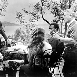 GUESS WHO'S COMING TO DINNER, (L-R), Spencer Tracy, Katharine Hepburn, Katharine Houghton, Sidney Poitier, being directed by Stanley Kramer, 1967. (Everett Collection)