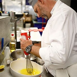 JD Skene demonstrating the Whiskpenser in the LaPointe kitchen in Ottawa September 28, 2016. Working with George Brown, Skene invented the Whiskpenser, a whisk-dispenser bottle combo to make incorporating wet ingredients easier for people with cerebral palsy and other disabilities. (Photography by Blair Gable)