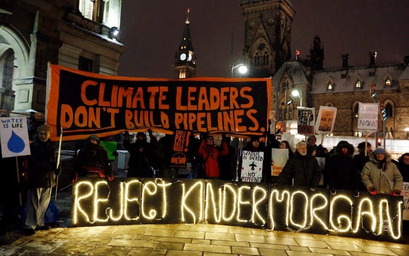 People protest against the proposed Kinder Morgan pipeline outside Prime Minister Justin Trudeau's office, below Parliament Hill on November 21, 2016. THE CANADIAN PRESS/Fred Chartrand