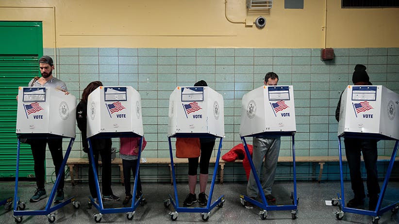 People vote at a polling site at Public School 261, November 8, 2016 in New York City. Citizens of the United States will choose between Republican presidential candidate Donald Trump and Democratic presidential candidate Hillary Clinton. (Drew Angerer/Getty Images)