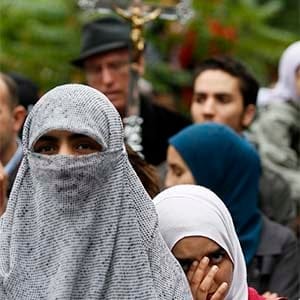 People gather to protest against Quebec's proposed Charter of Values in Montreal, September 14, 2013. Thousands took to the streets to denounce the province's proposed bill to ban the wearing of any overt religious garb by government paid employees. (Christinne Muschi/Reuters)