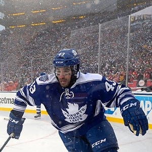Nazem Kadri #43 of the Toronto Maple Leafs and Niklas Kronwall #55 of the Detroit Red Wings skate in the corner in the overtime during the 2014 Bridgestone NHL Winter Classic on January 1, 2014 at Michigan Stadium in Ann Arbor, Michigan.  (Brian Babineau/NHLI/Getty Images)