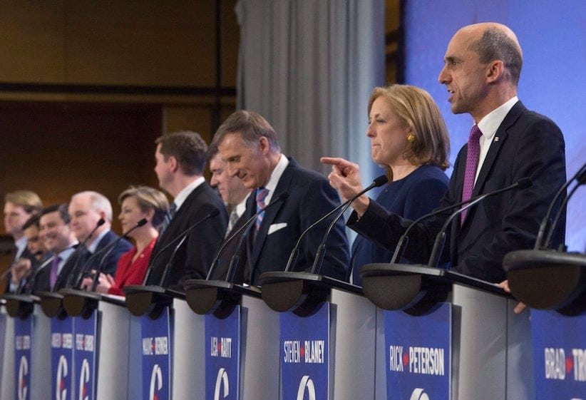 Leadership candidate Steven Blaney, right, speaks during the Conservative Party French language leadership debate, Tuesday, January 17, 2017 in Quebec City. Lisa Raitt, centre, looks on. (Jacques Boissinot/CP)
