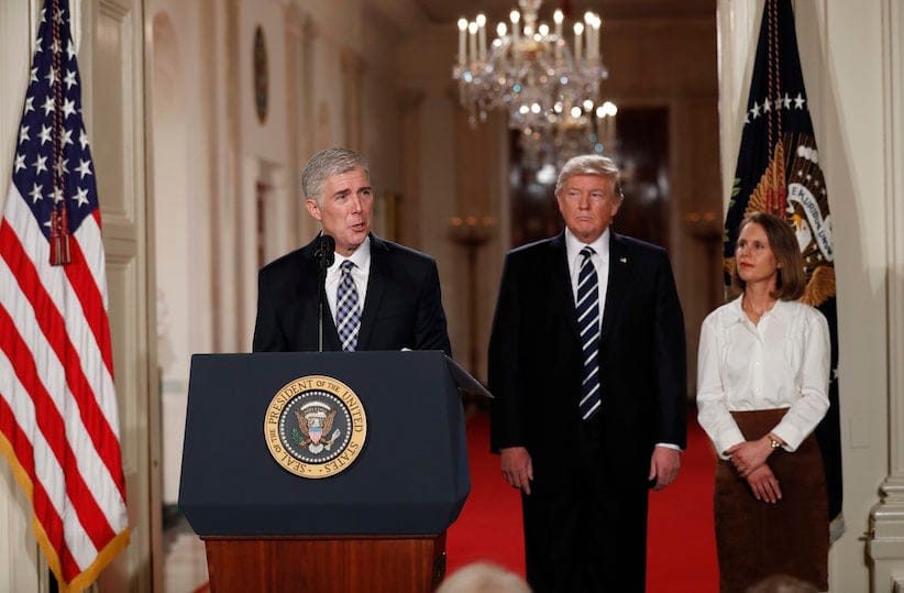 Judge Neil Gorsuch speaks as his wife Louise and President Donald Trump stand with him on stage in East Room of the White House in Washington, Tuesday, Jan. 31, 2017, after the president announced Judge Neil Gorsuch as his nominee for the Supreme Court. (AP Photo/Carolyn Kaster)