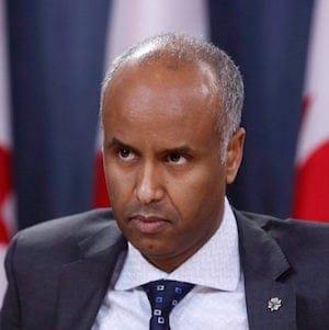 Ahmed Hussen, Minister of Immigration, Refugees and Citizenship, holds a news conference to update Canadians on the possible impacts of recent immigration-related decisions made by President Donald Trump, in Ottawa on Sunday, January 29, 2017. THE CANADIAN PRESS/Fred Chartrand