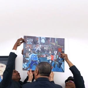 Rep. Cedric Richmond, chairman Congressional Black Caucus, Rep. William Lacy Clay and Rep. Alma Adams rehang a painting on the U.S. Capitol walls after it was removed by Rep. Duncan Hunterbecause he found it offensive on January 10, 2017 in Washington, DC. (Joe Raedle/Getty Images)