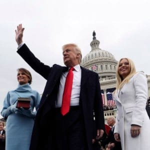 WASHINGTON, DC - JANUARY 20:  U.S. President Donald Trump acknowledges the audience after taking the oath of office as his wife Melania (L) and daughter Tiffany watch during inauguration ceremonies swearing in Trump as the 45th president of the United States on the West front of the U.S. Capitol in Washington, DC. January 20, 2017. (Photo by Jim Bourg - Pool/Getty Images)