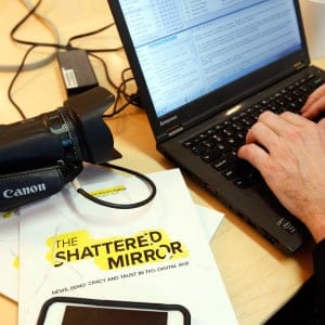 A reporter works on his story after Edward Greenspan, president and chief executive officer of the Public Policy Forum, held a news conference to release his report The Shattered Mirror, in Ottawa Thursday, January 26, 2017. (Fred Chartrand/CP)