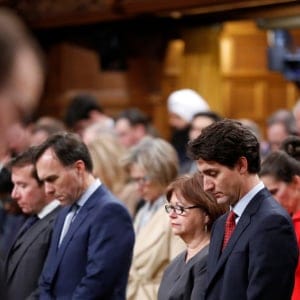 Canada's Prime Minister Justin Trudeau (front, 2nd R) joins fellow MPs in a moment of silence after delivering a statement on a deadly shooting at a Quebec City mosque, in the House of Commons on Parliament Hill in Ottawa, Ontario, Canada, January 30, 2017. (Chris Wattie/Reuters)
