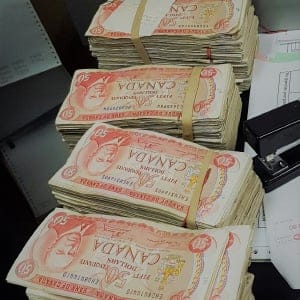 Employees at Global Electric Electronic Processing in Barrie, Ont. found $100,000 in $50 bills hidden inside a television. (Global Electric Electronic Processing)